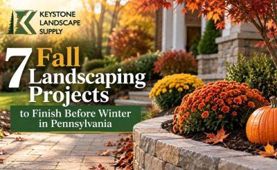 Fall landscaping featuring mums, pumpkins, a stone retaining wall, and autumn foliage with the headline “7 Fall Landscaping Projects to Finish Before Winter in Pennsylvania.